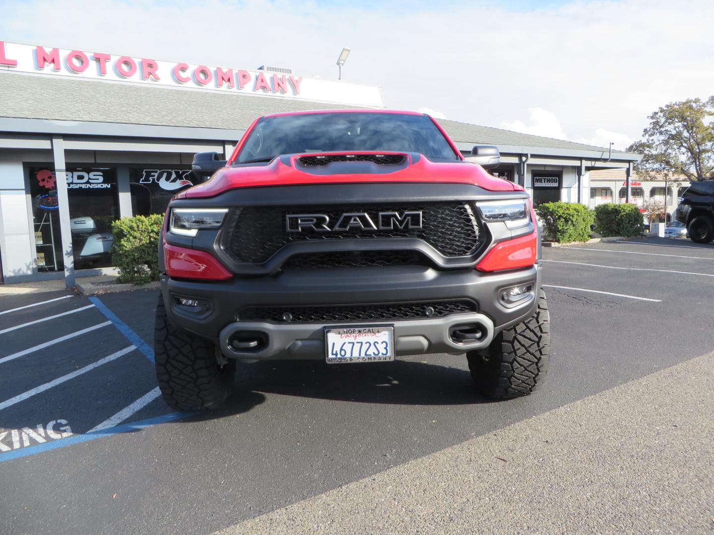 2023 Red /BLACK RAM 1500 Ram 1500 TRX Crew Cab 4x4 (1C6SRFU9XPN) with an 6.2L Supercharged HEMI V8 SRT engine, 8 Speed Auto 8HP95 transmission, located at 2630 Grass Valley Highway, Auburn, CA, 95603, (530) 508-5100, 38.937893, -121.095482 - Must see TRX featuring Eibach front and rear springs, 18" Method NV double black wheels, 37" Nitto Ridge Grappler tires, and window tint. - Photo#1